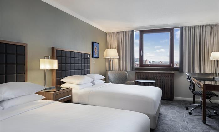 Deluxe Family rooms with 2 Double beds. Featuring a panoramic view of Swansea Marina.